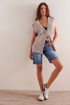 Cozy and cool from our We The Free collection, this slouchy vest features a ribbed merino wool fabrication and deep V-neckline with button-front closures and low-cut armholes. **Fit:** Slouchy, relaxed fit **Features:** Soft merino wool fabrication, ribbed knit design, deep V-neckline, button-front closures, sleeveless-style with low-cut armholes **Why We ❤ It:** This wool vest is perfect for pulling on over your favorite long-sleeve layer. | We The Free Corey Vest Jacket at Free People in White Trendy Oversized Sweater Vest For Fall, Oversized Sweater Vest For Spring Layering, Trendy Sweater Vest For Everyday Fall Wear, Trendy Fall Sweater Vest For Everyday, Fall Ribbed Vest For Layering, Trendy Winter Sweater Vest For Everyday, Trendy Everyday Winter Sweater Vest, Winter Ribbed Vest, Ribbed Vest For Winter Layering