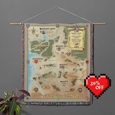 a map hanging on the wall next to a potted plant with a red heart