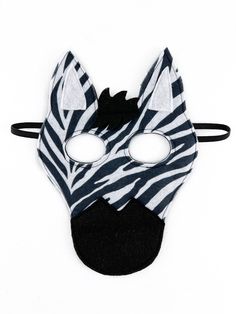 a zebra mask with black and white stripes