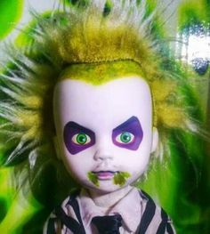 a creepy doll with green eyes and yellow hair