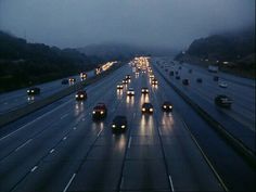 a highway filled with lots of traffic at night