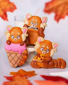 three brown bears sitting on top of an ice cream cone