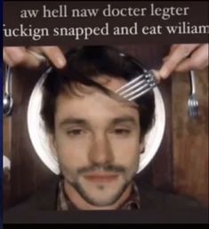 a man is getting his hair cut with fork and spoons in front of him