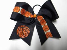 an orange and black basketball themed bow