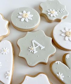 decorated cookies arranged in the shape of hearts and flowers