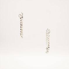 An edgy versatile wardrobe essential, the Dangling Sterling Silver Cuban Chain Earrings were lovingly handmade for the everyday slay in mind. Look like a Rockstar when earrings are worn as a single, paired, or styled asymmetrically with any of our jewelry. Sold as a Single or Pair, for head-turning looks. Solid Sterling Silver Cuban Chain 4.6mm width About 1.75" drop, 3" chain length In-stock jewelry ships within a 2-3 day process. If SOLD OUT on TikTok Shop, pre-order online via link in bio und Everyday Sterling Silver Chain Earrings, Sterling Silver Chain Drop Earrings, Modern Drop Earrings With Silver Chain, Modern Silver Chain Drop Earrings, Silver Chain Earrings For Everyday, Sterling Silver Earrings With Adjustable Chain For Everyday, Trendy Silver Chain Link Earrings, Minimalist Silver Chain Earrings, Modern Earrings With Silver Chain For Gift