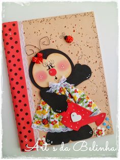 a handmade card with a black bear holding a red umbrella and polka dot ribbon