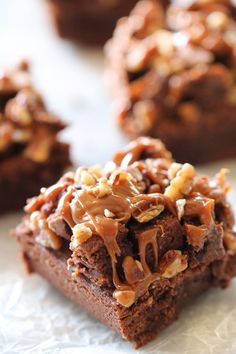 some brownies with nuts on top of them