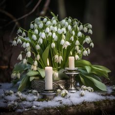 flowers and candles sit on snow covered ground