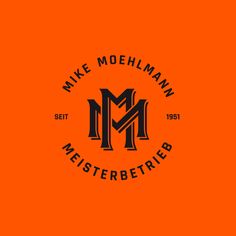 an orange and black logo with the words mike moehman, meinsterberg