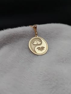 Discover serenity and style with our Lotus Yin Yang Necklace, a dainty floral piece meticulously crafted in 14K solid gold. This minimalist spiritual necklace is perfect for yoga enthusiasts and meditation lovers, embodying balance and harmony through its elegant design. ⚜️ Package included: One Handmade Necklace ⚜️ Pendant Sizes: 14 / 16 / 18 / 20 / 22 / 24 / 26 / 28 / 30 mm ⚜️ Necklace Length: 14 / 16 / 18 / 20 / 22 inches ⚜️ Materials: 925 Sterling Silver / Gold Plated / 14K Solid Gold FAQ: ✈️ Express and Free Shipping. 📦 Items will be shipped within 1-2 business days. 🛒 Delivery times vary between 2-5 business days depending on the country of the order.  ⚠️ Customizable items are neither exchangeable nor refundable. Please visit our Etsy shop to see all our items. We have 14k gold ne Sacred Jewelry, Yin Yang Necklace, Spiritual Necklace, Mens Chain Bracelet, Yoga Necklace, Gold Lotus, Balance And Harmony, Jewelry Accessories Ideas, Yoga Jewelry