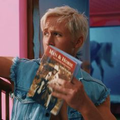 a person sitting in a chair reading a book