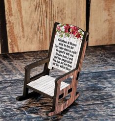 a wooden rocking chair with a poem on it