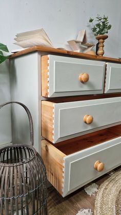 an old dresser has been painted with white paint