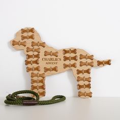 a wooden toy dog with its leash attached to it