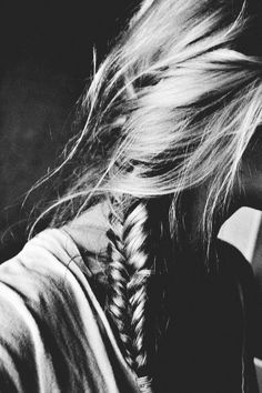 black and white photograph of a woman's hair with braids on her head