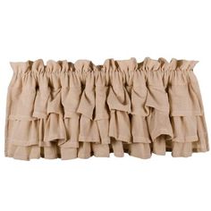 a tan curtain with ruffled edges on a white background