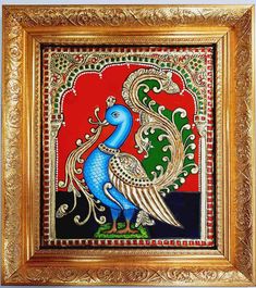 an ornate painting with a blue bird on red and green background, framed in gold frame