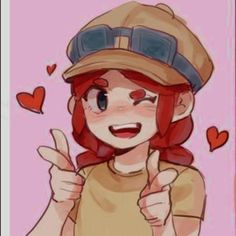 a girl with red hair wearing a hat and giving the thumbs up sign in front of her