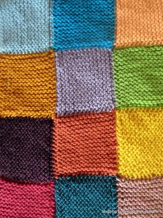 a multicolored knitted blanket with different colors