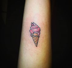 an ice cream cone tattoo on the arm