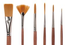 an assortment of paint brushes on a white background