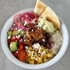 a white bowl filled with different types of food