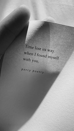 someone holding up a piece of paper with a quote on it that reads, time lost its way when i found myself with you