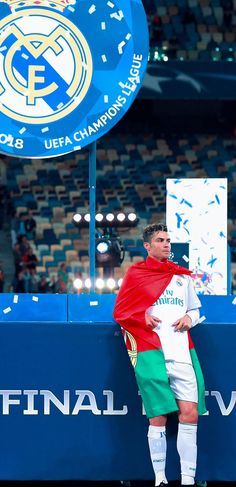 a man standing on top of a soccer field