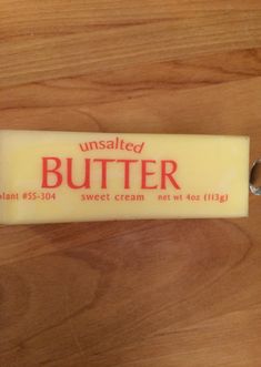 a bar of butter sitting on top of a wooden table