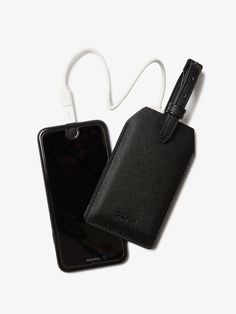 • Dual-purpose luggage tag and portable charger • USB-C and Lightning compatible for easy charging on the go• Polyurethane (PU) exterior with a removable label for personal info• Compact design, perfect for a portable travel charger• California Proposition 65 Stay powered up with the Portable Luggage Tag & Charger, a sleek tag for luggage that doubles as a portable phone charger. With a faux leather exterior and a 2500 mAh battery, this portable travel charger is compatible with USB-C and Lightn Calpak Luggage, Luggage Tag Designs, Portable Phone Charger, Stylish Luggage, Travel Charger, Luggage Cover, Portable Charger, Luggage Sets, Carry On Luggage