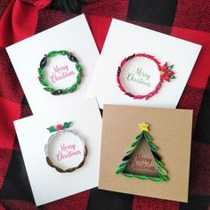 four cards with christmas designs on them sitting next to each other and the words merry christmas