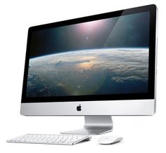 an apple desktop computer with the earth in the background and keyboard on the left side