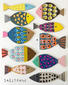 a group of colorful fish made out of paper