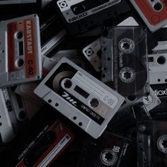 a pile of old and used cassettes