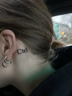 a woman with the word cut behind her ear