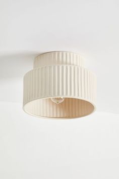 a white ceiling light hanging from the ceiling