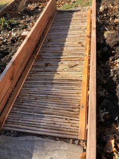 a wooden walkway going up the side of a hill