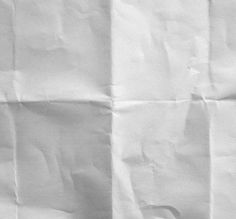 a black and white photo of a piece of paper that has been folded in half