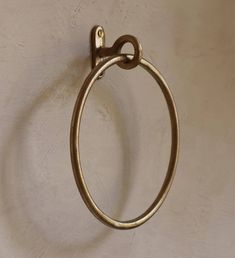 a metal towel ring hanging on the wall