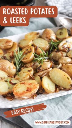 roasted potatoes and leeks on a white platter with rosemary garnishes