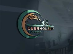 the logo for oberhollzer borderry is shown in gold and green