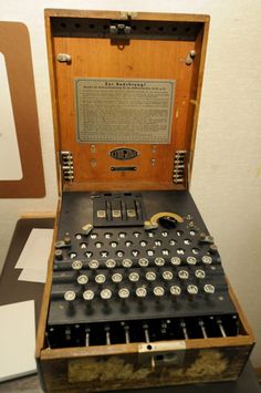 an old fashioned typewriter in a wooden case