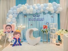 a baby's first birthday party with balloons and decorations