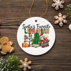 santa's favorite library ornament with christmas tree and presents on wooden table