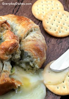 a close up of food on a plate with crackers