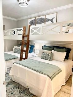 a room with two beds and a ladder