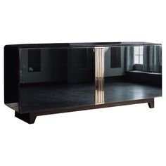 a black and gold sideboard with glass doors on the front, in an empty room