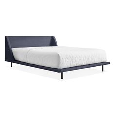 an image of a bed with a mattress on the bottom and headboard upholstered