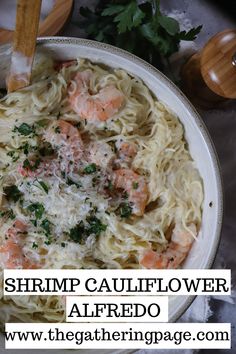 shrimp cauliflower alfredo in a white bowl with parsley